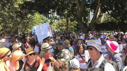 Anti-Trump signs were visible among the sea of protestors. (Mary Jordan, 9NEWS)