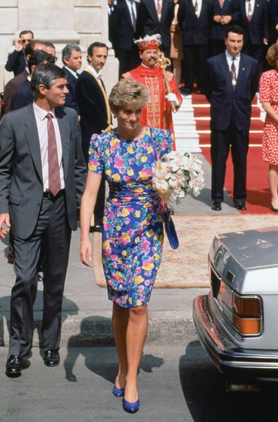 SPAIN - MAY 21:  Diana, Princess of Wales outside the Town Hall in Seville with bodyguard Colin Trimming, She is wearing a dress designed by fashion designers Bellville Sassoon  (Photo by Tim Graham Photo Library via Getty Images)