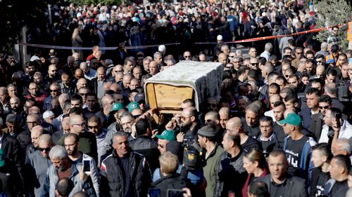 Mourners carry the coffin of student Aya Maasarwe, who was killed in Melbourne, during the funeral at her hometown of Baqa al-Gharbiya, Israel.