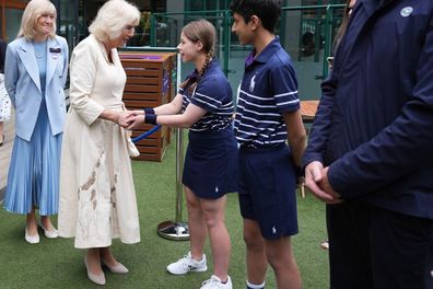 Queen Camilla meets ball kids Natalia from Burntwood School in Wandsworth and Yug from 