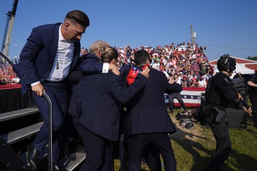 Republican presidential candidate former President Donald Trump is surrounded by US Secret Service agents