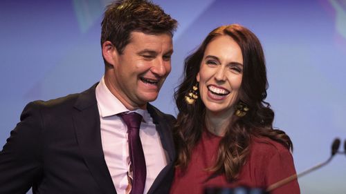 New Zealand Prime Minister Jacinda Ardern, right, is congratulated by her partner Clarke Gayford following her victory speech to Labour Party members at an event in Auckland, New Zealand, Saturday, Oct. 17, 2020