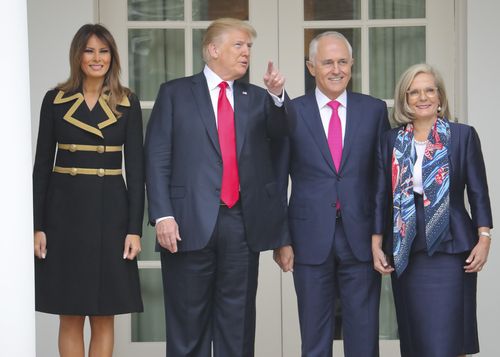 Mr Trump, first lady Melania Trump, left, with Mr Turnbull and his wife Lucy Turnbull, right, stop to look at the Rose Garden at the White House in Washington. (AAP)