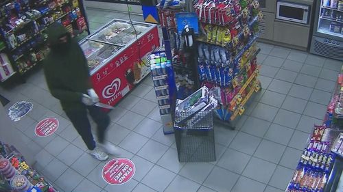Man held at knifepoint during armed robbery of Sydney service station