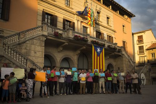 Members of the local Muslim community gather along with relatives of young men believed responsible for the attacks in Barcelona and Cambrils. (AP)