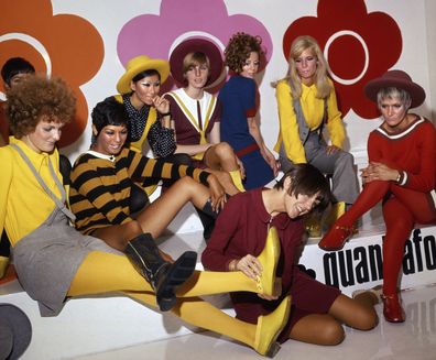 British fashion designer Mary Quant, foreground centre, poses with models wearing her creations, in London, on Aug. 1, 1967. m 