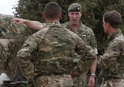 Britain's Prince William, 2nd right, speaks to soldiers during a visit to the 1st Battalion the Irish Guards battle group, training under the British Army Training Unit Kenya (BATUK), in his role as Colonel of the Regiment, in Laikipia, Kenya Sunday, Sept. 30, 2018. Britain's Prince William, who has campaigned against the killing of elephants, rhinos, and other species, is in Africa this week to discuss threats to conservation ahead of a London conference on the illegal wildlife trade. 