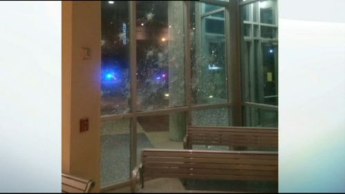 The shattered front of the Dallas PD building. (Dallas PD)