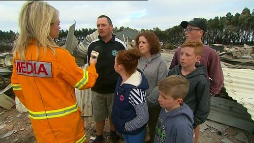 The Terang family return to their home, counting the damage after the horrific fires. (9NEWS)