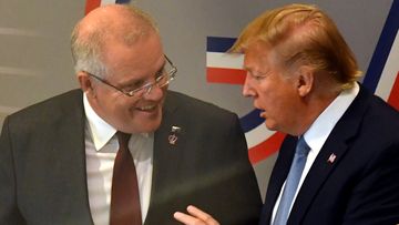 US President Donald Trump and Australia's Prime Minister Scott Morrison leave together after a meeting during the G7 Summit in the town of Biarritz, France.