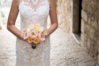 Bride holding flowers