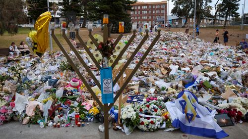 SYDNEY, AUSTRALIA - DECEMBER 21: General view of the memorial at Bondi Pavilion on December 21, 2025 in Sydney, Australia. Life slowly returned to normal at Bondi Beach, with people from all walks of life still paying respects and tributes as raw grief and funerals gave way to quiet commemorations. Police say at least 16 people, including one suspected gunman, were killed and more than 40 others injured when two attackers opened fire near a Hanukkah celebration at the world-famous Bondi Beach, i