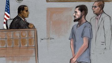 In this Friday, June 12, 2015, file courtroom sketch, Nicholas Rovinski, second from right, of Warwick, R.I., is depicted standing with his attorney William Fick, right, as Magistrate Judge Donald Cabell, left, presides during a hearing in federal court in Boston