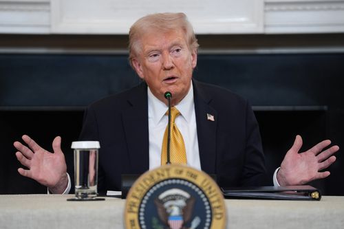 President Donald Trump answers questions from reporters during a roundtable on criminal cartels in the State Dining Room of the White House