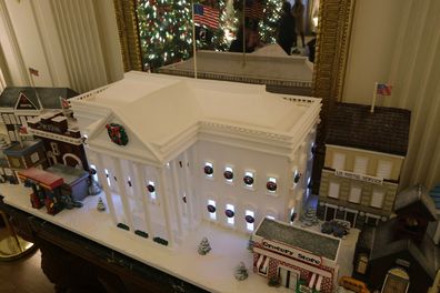 WASHINGTON, DC - NOVEMBER 29:  The official 2021 Gingerbread White House is displayed in the State Dining Room of the White House during a press preview of the holiday decorations November 29, 2021 in Washington, DC. The 2021 White House holidays theme is Gifts from the Heart. A variety of interactive viewing experiences will be launched on digital platforms, including Instagram, Google Maps Street View, Snapchat, and others that will allow the public to engage with the White House from home ove