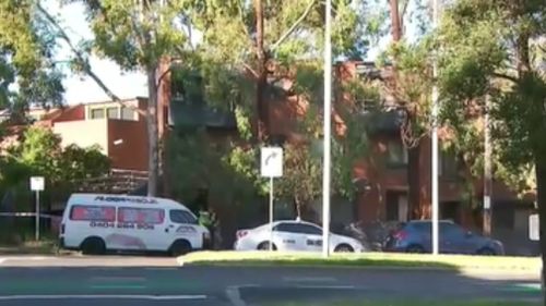 A passer-by found the man's body outside the block. (9NEWS)