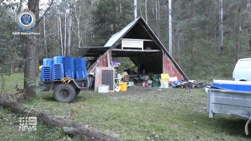 The property in Colo, said to be run by members of Blockade Australia, was being watched by camouflage police yesterday when the cops were spotted