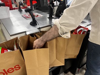 shopping bags at supermarket groceries coles woolworths aldi 