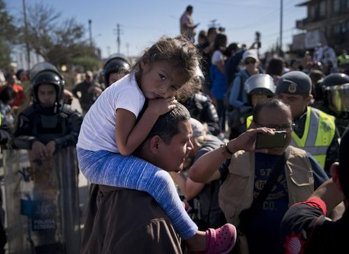 Men, women and children were all hit by the highly potent teargas as US Border Guards prevented them from going any further.