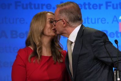 Labor Party leader Anthony Albanese, right, kisses his partner partner Jodie Haydon while thanking supporters at a Labor Party event in Sydney, Australia, Sunday, May 22, 2022