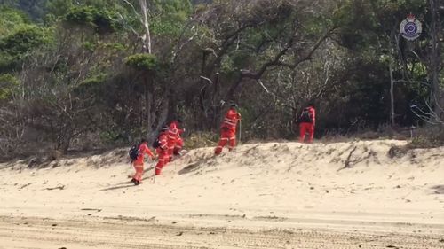 Police and SES continue to search the beach.