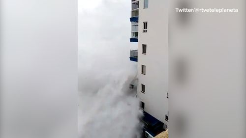 The waves took out a third-floor balcony.