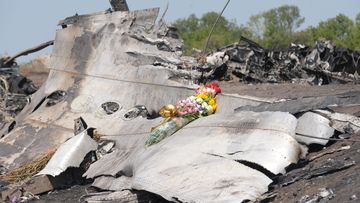 Flowers laid at the MH17 crash site by the Australian parents of 25-year-old Fatima Dyczynski. (Getty)