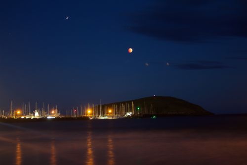 Cloud cover might obscure Australians' view of the spectacle in every capital city except Perth - meaning it may not be as clear as this eclipse over Coffs Harbour, NSW (AAP).