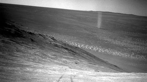 From its perch high on a ridge, Opportunity recorded this image of a Martian dust devil.