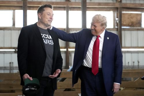 Tesla and SpaceX CEO Elon Musk, left, and Donald Trump attend a campaign event at the Butler Farm 