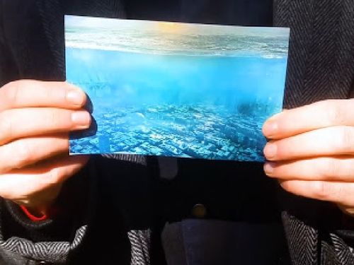 In a closer look at the picture, a city can be seen submerged below perfectly clear blue water. (Supplied/ApexTV)