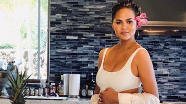 Chrissy Teigen does maternity in her own style and we love her for it. Image: Instagram/@Chrissyteigen