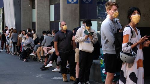 People are seen lining up to get tested for Coronavirus at the Royal Melbourne Hospital  on Tuesday 10 March 2020.  