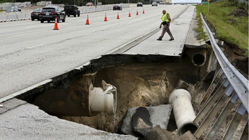 A portion of the interstate highway northeast of Orlando washed away during Hurricane Irma's passing through central Florida. (AAP)