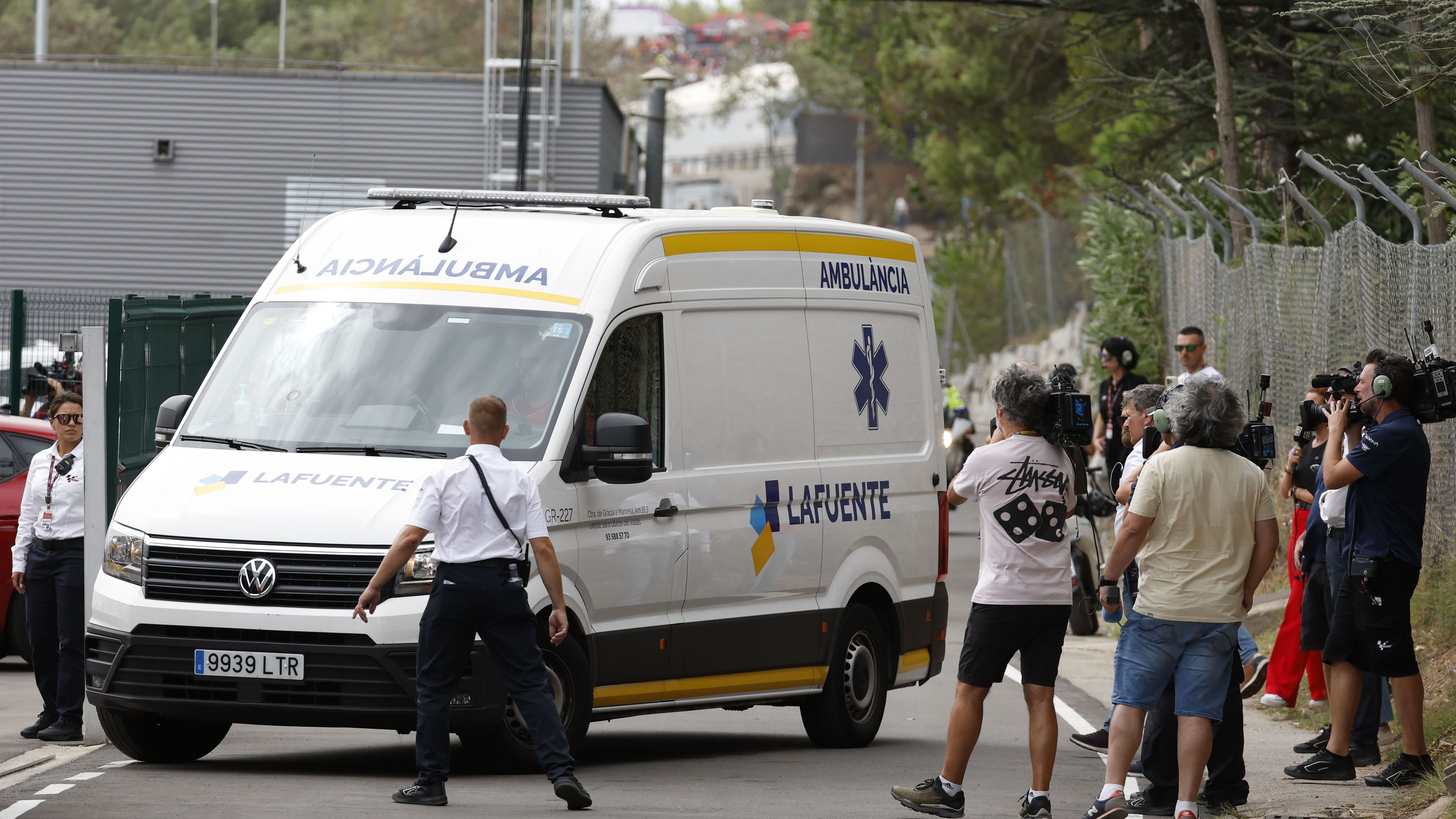 An ambulance carrying Francesco Bagnaia arrives at the medical center after he was involved in a crash during the first lap of the race of the MotoGP Grand Prix at the Catalunya.