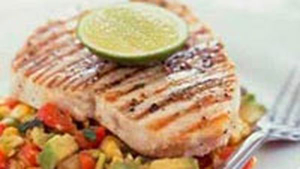 Char-grilled swordfish on warm avocado corn salad