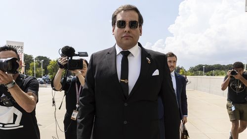 FILE - Former U.S. Rep. George Santos arrives at court in Central Islip, N.Y., Aug. 19, 2024. (AP Photo/Stefan Jeremiah, File)