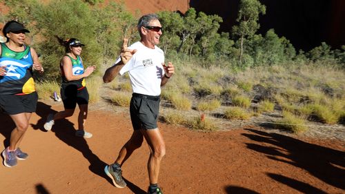 Pat Farmer at Uluru in the final metres of his Run for the Voice.