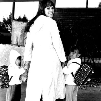 Melanie steps out with her children, Jeordie (left) and Leilah.  Folk rock singer Melanie Safka just hates to be parted from her two young children. May 29, 1977.