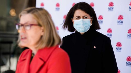 NSW Premier Gladys Berejiklian listens as Chief Health Officer Kerry Chant speaks.