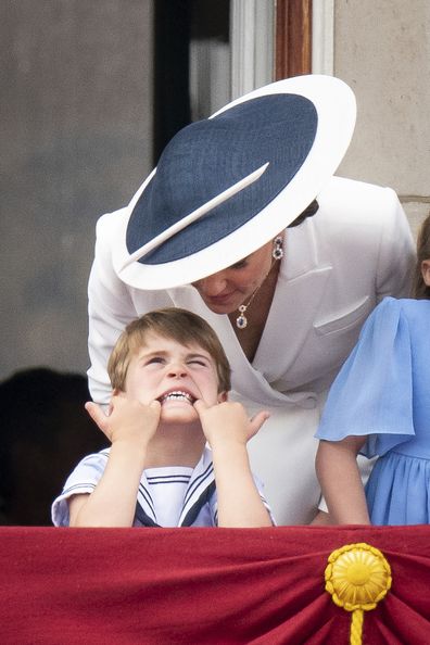 Kate, Duchess of Cambridge and Prince Louis watch from the balcony of Buckingham Place after the Trooping the Color ceremony in London, Thursday, June 2, 2022, on the first of four days of celebrations to mark the Platinum Jubilee. The events over a long holiday weekend in the U.K. are meant to celebrate the monarch's 70 years of service.