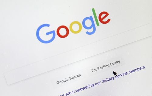 A cursor moves over Google's search engine page on Aug. 28, 2018, in Portland, Ore. 