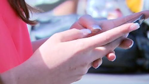 Children as young as three have their own smartphone. (9NEWS)