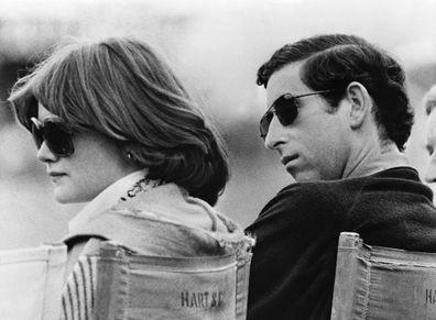 Prince Charles and Lady Sarah Spencer, the elder sister of Diana, watch a polo match at Windsor.