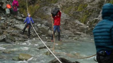 The Summit 2023: The trekkers throw cash over a waterfall