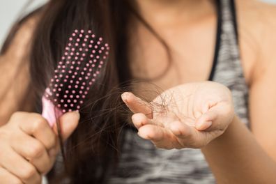 young woman worried about hair loss 