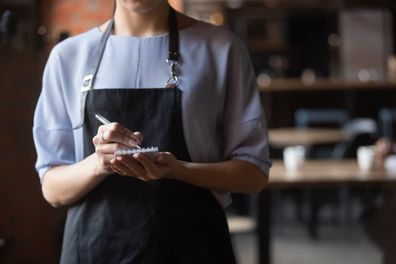 Waitress serving customer