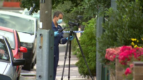 Police at the scene on Baxter Street. (9NEWS)