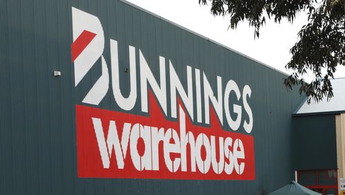 Melbourne, Australia - July 23, 2011: Bunnings is Australia\'s most successful hardware chain. Here is the outside of a store in Epping, Melbourne. It includes customers walking to the entrance, and cars parked nearby.