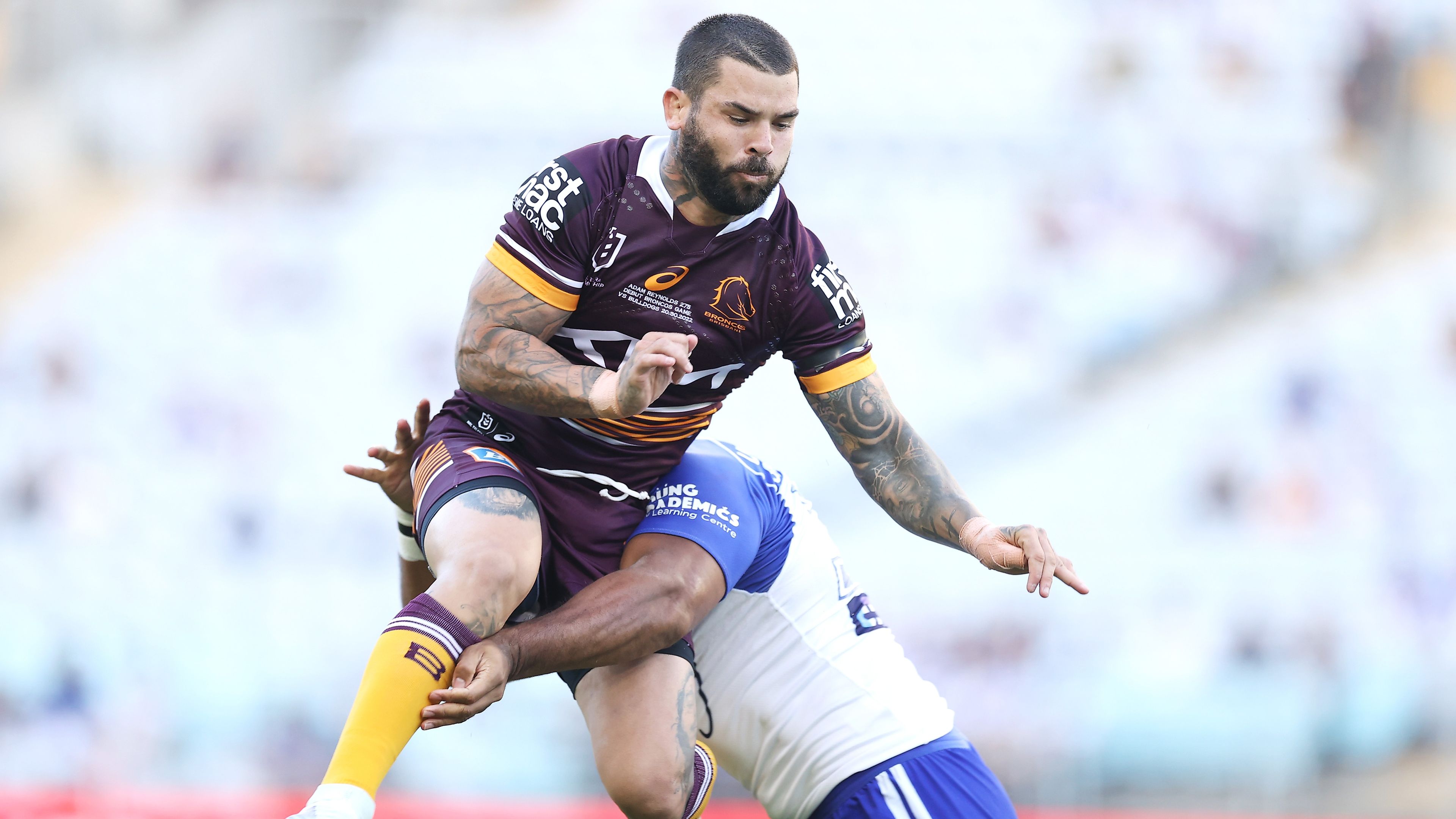 Brisbane&#x27;s Adam Reynolds is tackled in the air after a kick by Canterbury&#x27;s Tevita Pangai Junior.